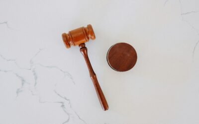 Judicial gavel on wooden bench